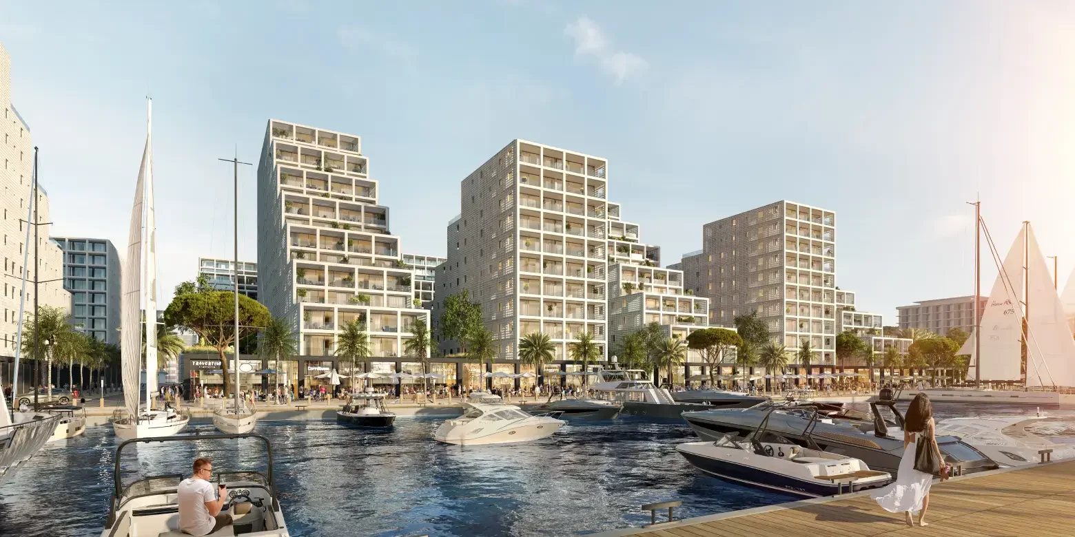 Modernen Stadtquartiers am Wasser mit mehrgeschossigen Wohnhäusern, Marina, Segelbooten und Promenade
